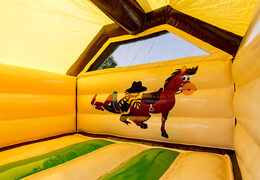 Cowboy themed inflatable slide combo bounce house for kids for sale. Order now inflatable bounce houses with slide at JB Inflatables America