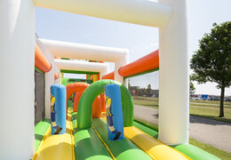 Buy soccer themed inflatable obstacle course with 7 game elements and colorful objects for kids now. Order inflatable obstacle courses now online at JB Inflatables America