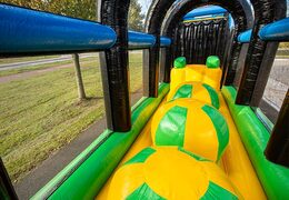Yellow and green obstacles on extreme survival track