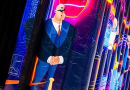 Illustration of a security guard with a bald head and sunglasses on a disco-themed bounce house