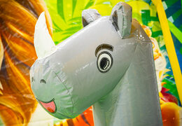 Jungle bounce house with colorful animals, available for sale.
