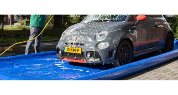 Man cleans Abarth car in inflatable car pool