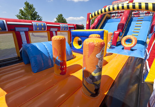Order an inflatable mega slide in the Fire Brigade World theme with 3D obstacles for kids. Buy inflatable slides now online at JB Inflatables America