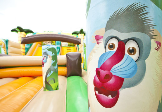 Buy jungle world themed inflatable mega slide with 3D obstacles for kids. Order inflatable slides now online at JB Inflatables America