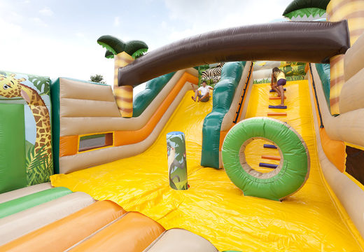 Order Inflatable Jungle World slide XL with 3D obstacles for children. Buy inflatable slides now online at JB Inflatables America