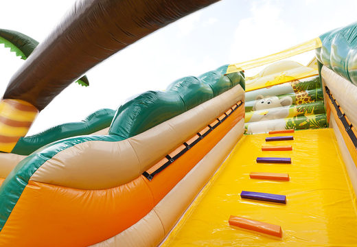 Buy large extra wide inflatable Jungle World slide with 3D obstacles for kids. Order inflatable slides now online at JB Inflatables America