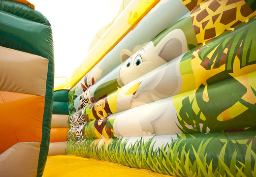 Order inflatable mega slide in jungle world theme with 3D obstacles for kids. Buy inflatable slides now online at JB Inflatables America