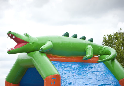 Order an inflatable multifun bounce house with roof and slide in a crocodile theme for kids with 3D object at the top at JB Inflatables America. Buy inflatable bounce houses online at JB Inflatables America