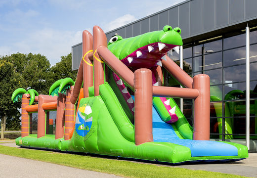 Buy a unique 17 meter wide crocodile themed obstacle course with 7 game elements and colorful objects for kids. Order inflatable obstacle courses now online at JB Inflatables America