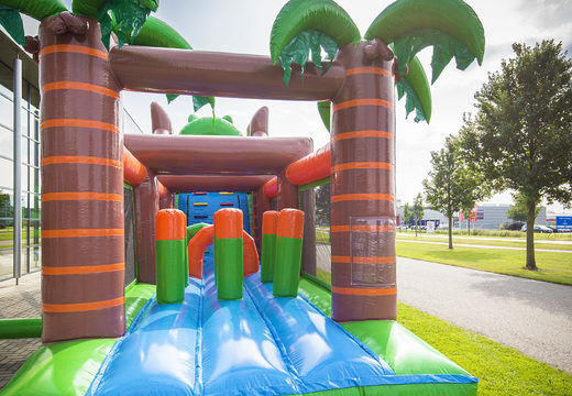 Buy inflatable unique 17 meter wide crocodile themed obstacle course with 7 game elements and colorful objects for children. Order inflatable obstacle courses now online at JB Inflatables America
