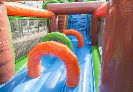 Unique 17 meter wide obstacle course in a crocodile theme with 7 game elements and colorful objects for kids. Buy inflatable obstacle courses online now at JB Inflatables America