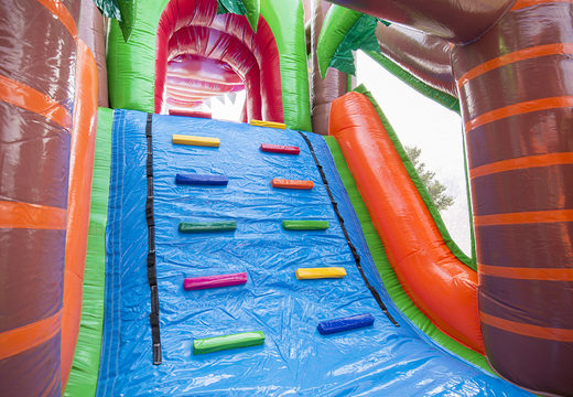 Crocodile themed inflatable obstacle course with 7 game elements and colorful objects for kids now. Order inflatable obstacle courses now online at JB Inflatables America