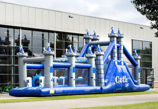 Order a 17 meter wide unique obstacle course in a castle theme with 7 game elements and colorful objects for children. Buy inflatable obstacle courses online now at JB Inflatables America