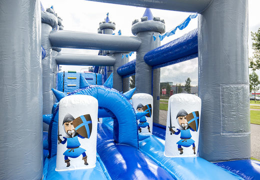 Castle run 17m obstacle course with 7 game elements and colorful objects for kids. Buy inflatable obstacle courses online now at JB Inflatables America