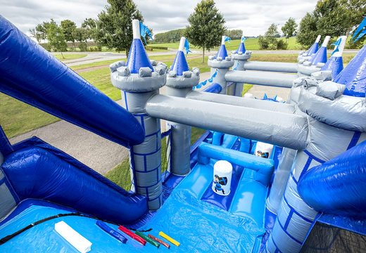Order an inflatable castle themed obstacle course with 7 game elements and colorful objects for kids. Buy inflatable obstacle courses online now at JB Inflatables America