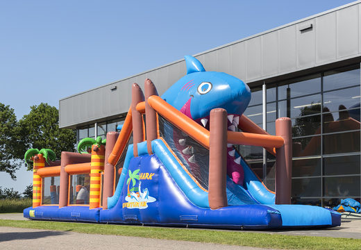 Buy a 17-metre-wide shark-themed obstacle course with 7 game elements and colorful objects for kids. Order inflatable obstacle courses now online at JB Inflatables America