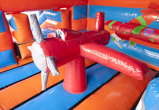 Buy an inflatable multifun bounce house for children  in an airplane theme with a roof, various obstacles, a slide and a 3D object on the roof at JB Inflatables America. Order bounce houses online at JB Inflatables America