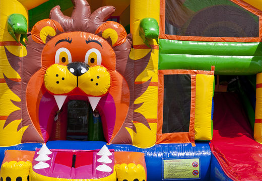 Bounce house in lion theme with slide, pillars on the jumping surface and striking 3D objects for children. Buy inflatable bounce houses online at JB Inflatables America