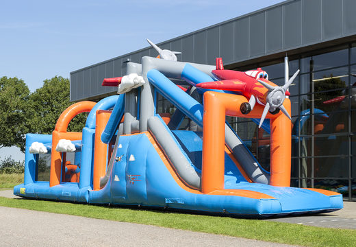 Buy a unique 17 meter wide airplane themed obstacle course with 7 game elements and colorful objects for kids. Order inflatable obstacle courses now online at JB Inflatables America