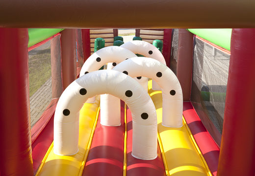 Unique 17 meter wide obstacle course in a cowboy theme with 7 game elements and colorful objects for kids. Buy inflatable obstacle courses online now at JB Inflatables America