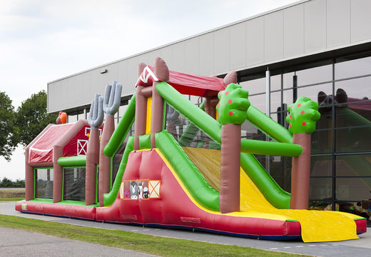 Order an inflatable farm-themed obstacle course with 7 game elements and colorful objects for kids. Buy inflatable obstacle courses online now at JB Inflatables America