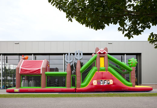 Order a unique 17 meter wide inflatable obstacle course in a farm theme for children. Order inflatable obstacle courses now online at JB Inflatables America