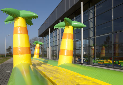 Order an inflatable 16m long belly slide in a jungle theme for kids. Buy inflatable belly slides now online at JB Inflatables America