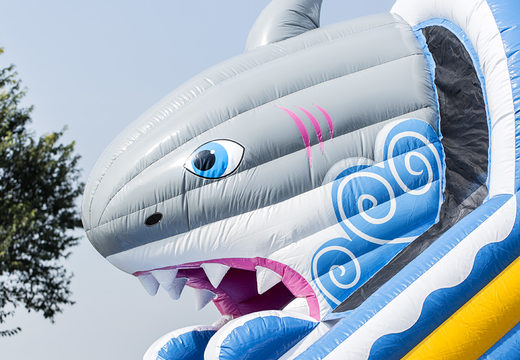 Get your inflatable shark slide with the cheerful colors and fun print on the back wall for children. Order inflatable slides now online at JB Inflatables America