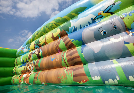 Buy a jungleworld themed inflatable slide with fun 3D figures and colorful prints for kids. Order inflatable slides now online at JB Inflatables America
