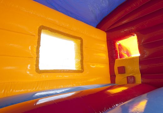 Buy an inflatable indoor maxi multifun bounce house in a clown theme with slide for kids. Order bounce houses online at JB Inflatables America