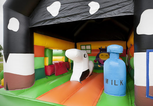 Order multifun cow bounce house with different obstacles, a slide and 3D figure of a cow on the roof for kids. Buy bounce houses online at JB Inflatables America