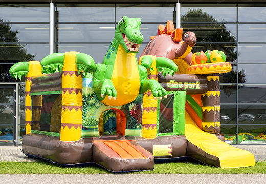 Order a multiplaybounce house in the dinoworld theme with slide for children. Buy inflatable bounce houses online at JB Inflatables America