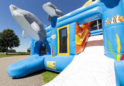Medium inflatable multiplay bounce house in dolphin theme with slide for children. Order inflatable bounce houses online at JB Inflatables America