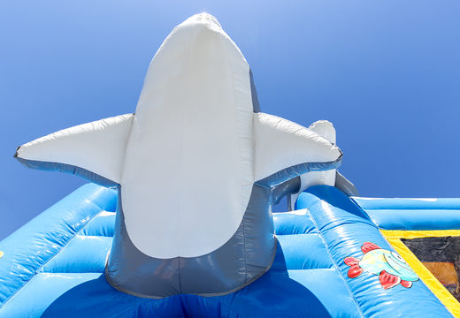 Medium inflatable dolphin themed bounce house with slide for kids. Order inflatable bounce houses online at JB Inflatables America