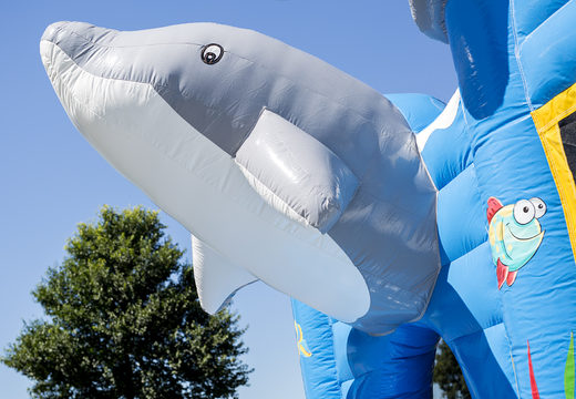 Buy a dolphin themed bounce house with a slide for children. Order inflatable bounce houses online at JB Inflatables America