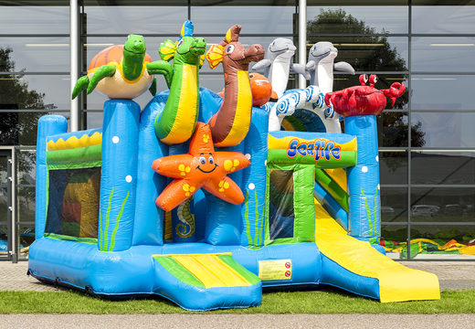 Buy medium indoor inflatable multiplay bounce house in the theme seaworld with slide for children. Order inflatable bounce houses online at JB Inflatables America