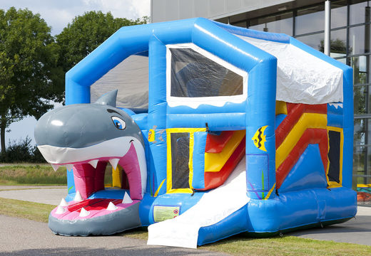 Shark themed bounce house with slide, pillars on the jumping surface and striking 3D object for children. Buy inflatable bounce houses online at JB Inflatables America