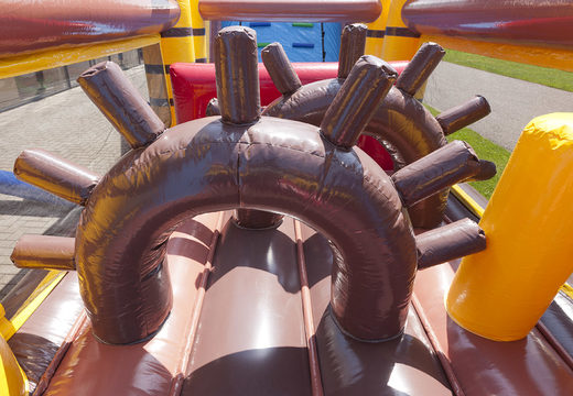 Order an inflatable pirate themed obstacle course with 7 game elements and colorful objects for kids. Buy inflatable obstacle courses online now at JB Inflatables America