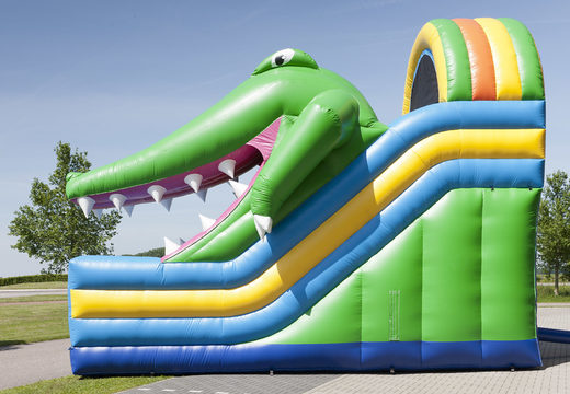 Inflatable slide with a crocodile theme with a splash pool, impressive 3D object, fresh colors and the 3D obstacle for children. Order inflatable slides now online at JB Inflatables America