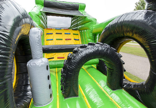 Unique 17 meter wide obstacle course in tractor theme with 7 game elements and colorful objects for kids. Buy inflatable obstacle courses online now at JB Inflatables America