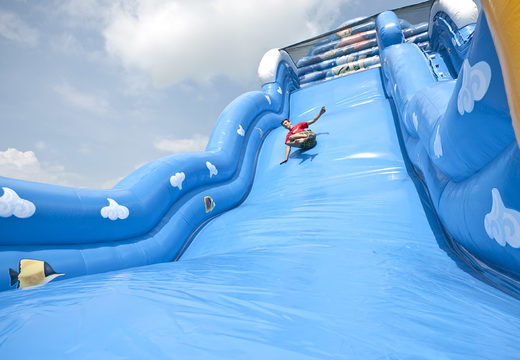 Order an inflatable slide in the Wave theme with a wavy sliding surface and fun underwater world prints for children. Buy inflatable slides now online at JB Inflatables America