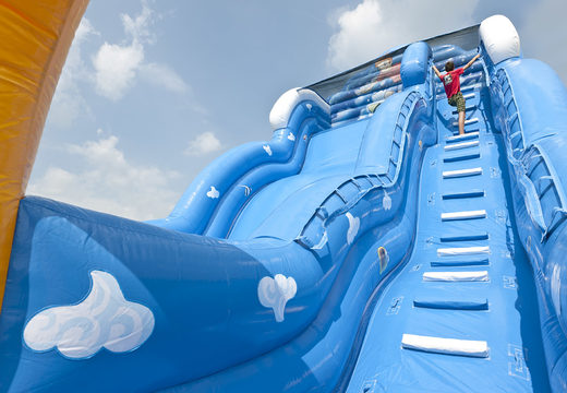 Wave inflatable slide with wavy sliding surface and fun underwater world prints for children. Buy inflatable slides now online at JB Inflatables America
