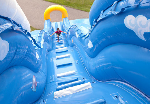 Order an inflatable wave-themed slide with a wavy sliding surface and fun underwater world prints for kids. Buy inflatable slides now online at JB Inflatables America