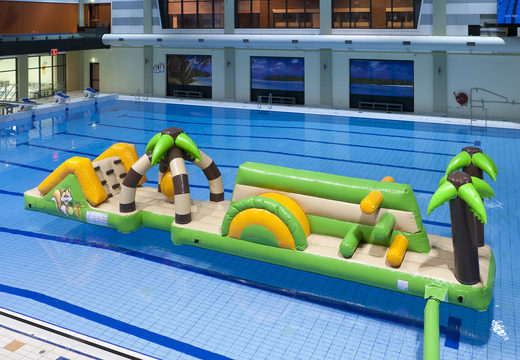 Inflatable double jungle run obstacle course with fun objects and round slide for both young and old. Order inflatable pool games now online at JB Inflatables America