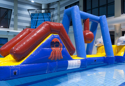 Inflatable marine run water assault course with 3D dolphins and cool prints for both young and old. Order inflatable obstacle courses online now at JB Inflatables America