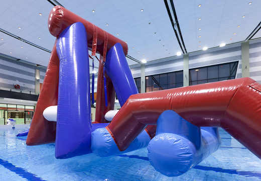 Inflatable Water obstacle run assault course with two climbing walls, a balancing object, a pendulum tower and a slide for both young and old to buy. Order inflatable pool obstacle courses now online at JB Inflatables America