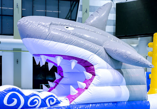 Spectacular inflatable shark run obstacle course in a unique design with funny 3D objects and no less than 2 slides for kids. Order inflatable water attractions now online at JB Inflatables America