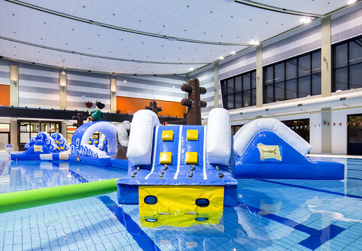 Get an airtight double inflatable 16 meter long pirate run swimming pool obstacle course in a unique design with funny 3D objects and no less than 2 slides for both young and old. Order inflatable obstacle courses online now at JB Inflatables America