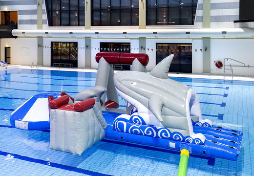 Buy an inflatable airtight shark play island with a vine, climbing tower, round slide and obstacles for both young and old. Order inflatable pool games now online at JB Inflatables America