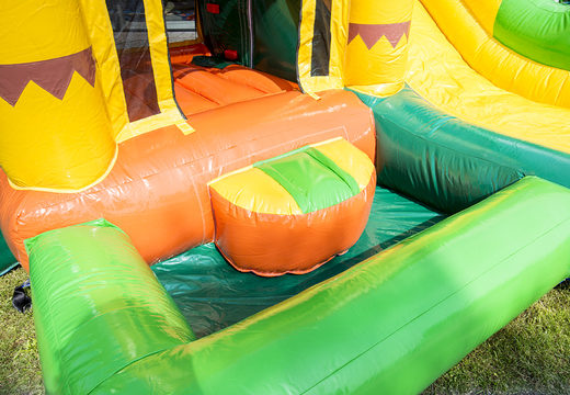 Mini inflatable multiplay bouncer  in jungle theme with slide for children. Order inflatable bouncers online at JB Inflatables America